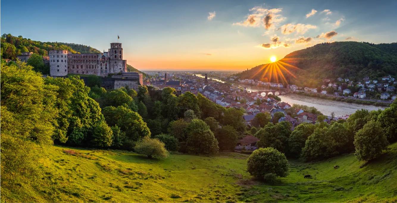 Schlüsseldienst in Heidelberg Blick auf Heidelberg mit Schloss und Neckar bei Sonnenuntergang
